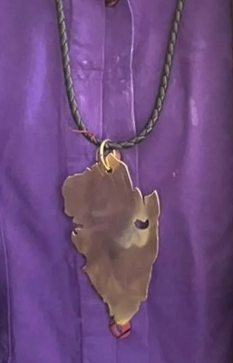 Energy Reflectors &mdash; cut metal pendant on a braided cord